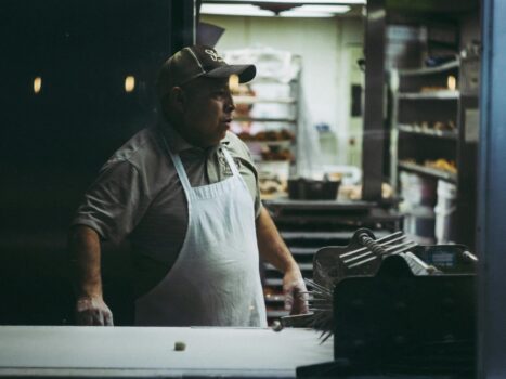 man wearing white apron