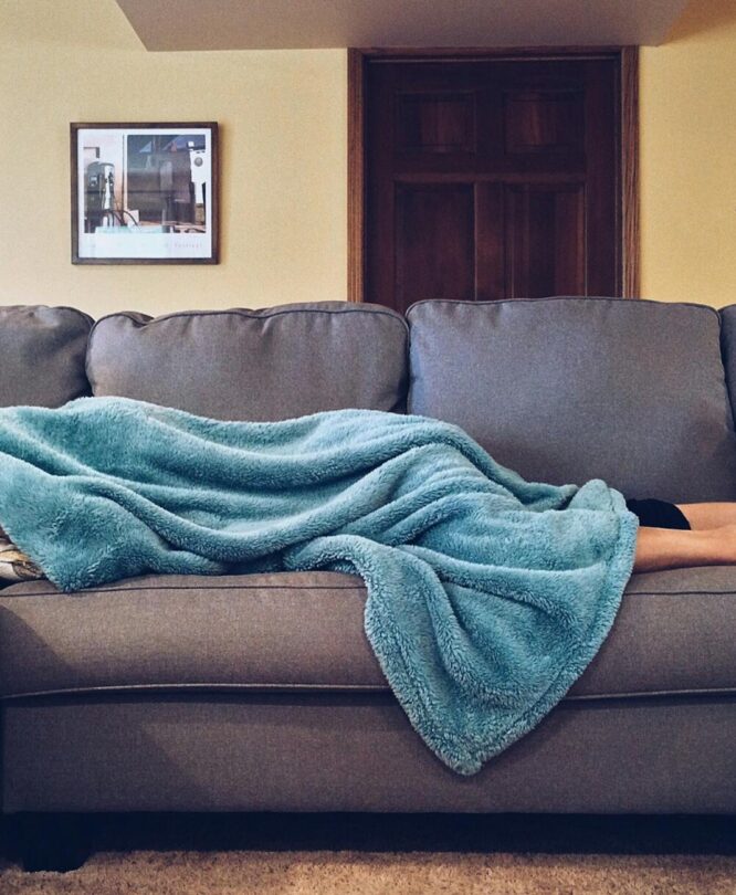 person lying on sofa