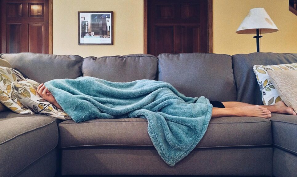 person lying on sofa